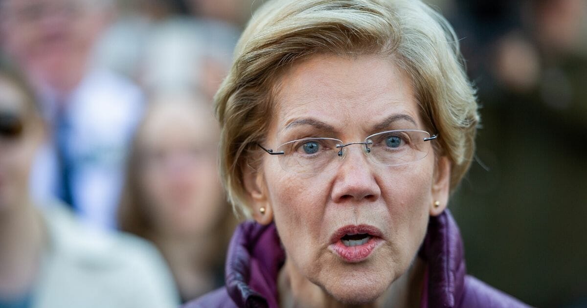 Sen. Elizabeth Warren announces the suspension of her presidential campaign in front of her Cambridge, Massachusetts, home on March 5, 2020.