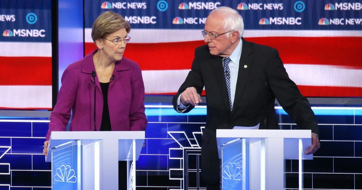 Sen. Elizabeth Warren (D-Massachusetts), left, and Sen. Bernie Sanders (I-Vermont) participate in the Democratic presidential primary debate at Paris Las Vegas on Feb. 19, 2020, in Las Vegas, Nevada.
