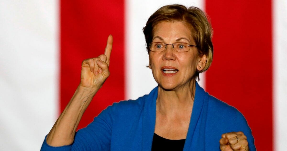 Massachusetts Sen. Elizabeth Warren gestures as she speaks during a campaign rally at Eastern Market in Detroit on March 3, 2020. She dropped out of the Democratic presidential race on March 5, 2020.