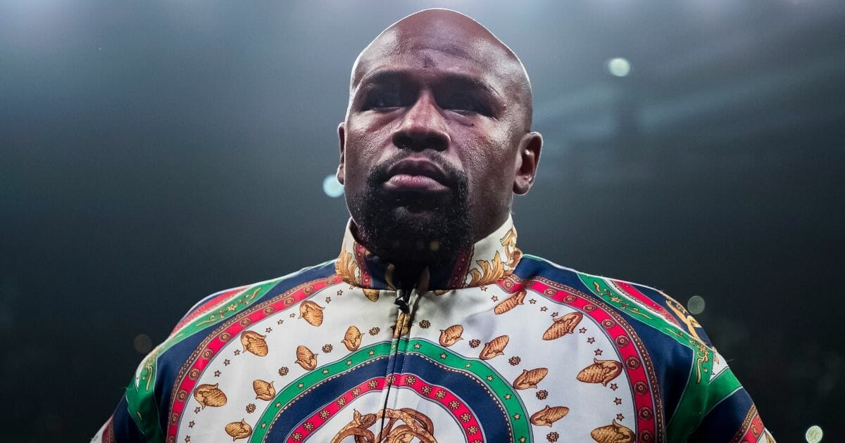 Floyd Mayweather Jr. looks on before the WBA super featherweight championship fight between Gervonta Davis and Ricardo Nunez at Royal Farms Arena in Baltimore on July 27, 2019.