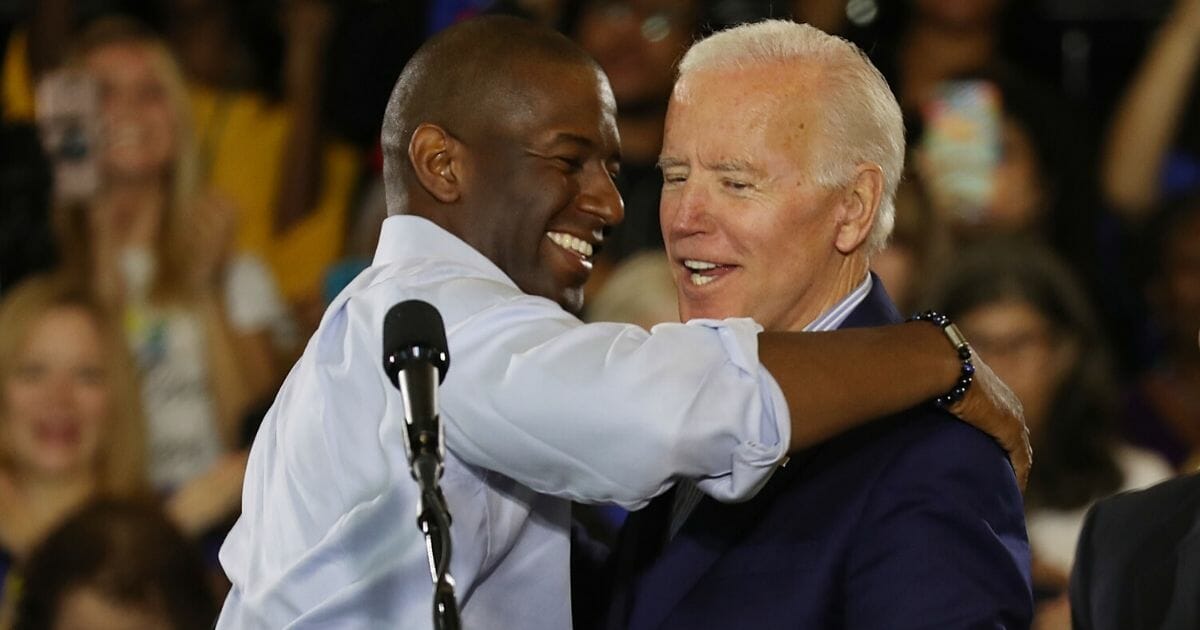 Andrew Gillum, then the Democratic candidate for governor of Florida, greets former Vice President Joe Biden during a campaign rally at the University of South Florida in Tampa on Oct. 22, 2018.