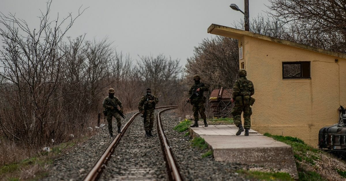 Greek army officers patrol at the railway station of Kastanies village, near the Greek-Turkish border, after Turkish President Recep Tayyip Erdogan called on Greece to "open the gates" to thousands of migrants.