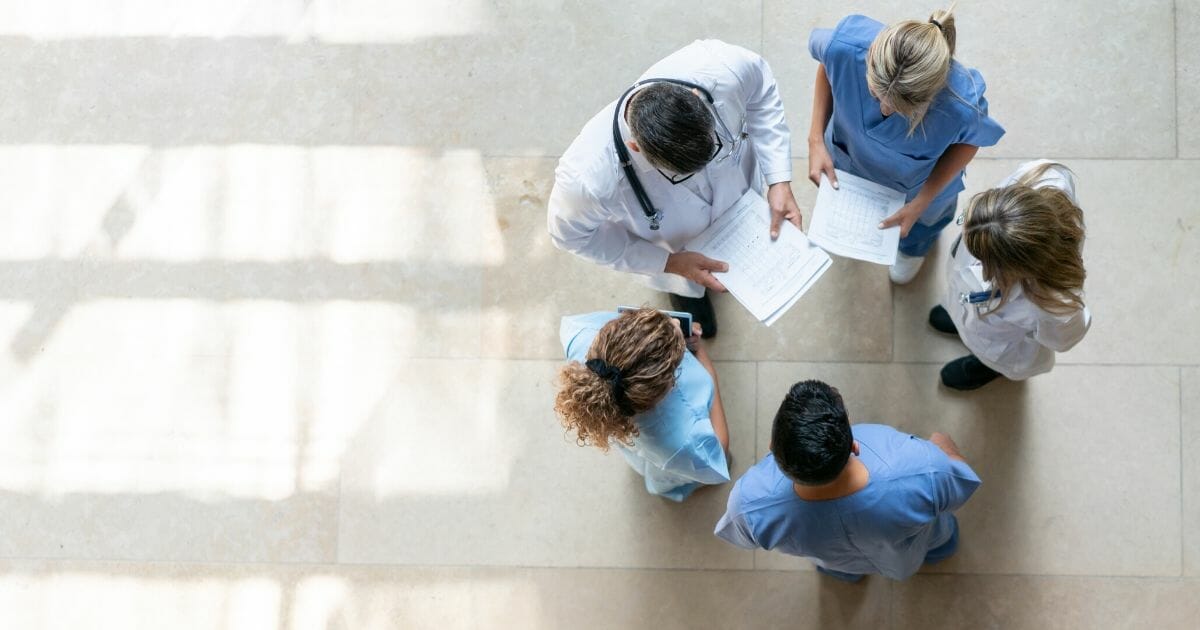 A group of health care professionals are pictured in the stock photo above.