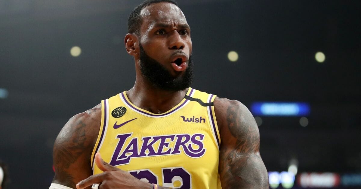 LeBron James #23 of the Los Angeles Lakers reacts to a play against the Philadelphia 76ers during the first half at Staples Center on March 3, 2020, in Los Angeles, California.
