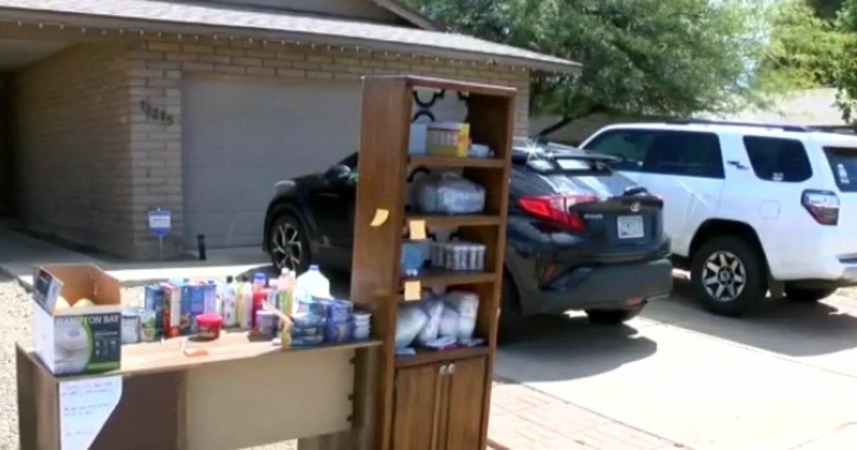 The Logan family's "giving bookshelf" stands outside their house in Phoenix.