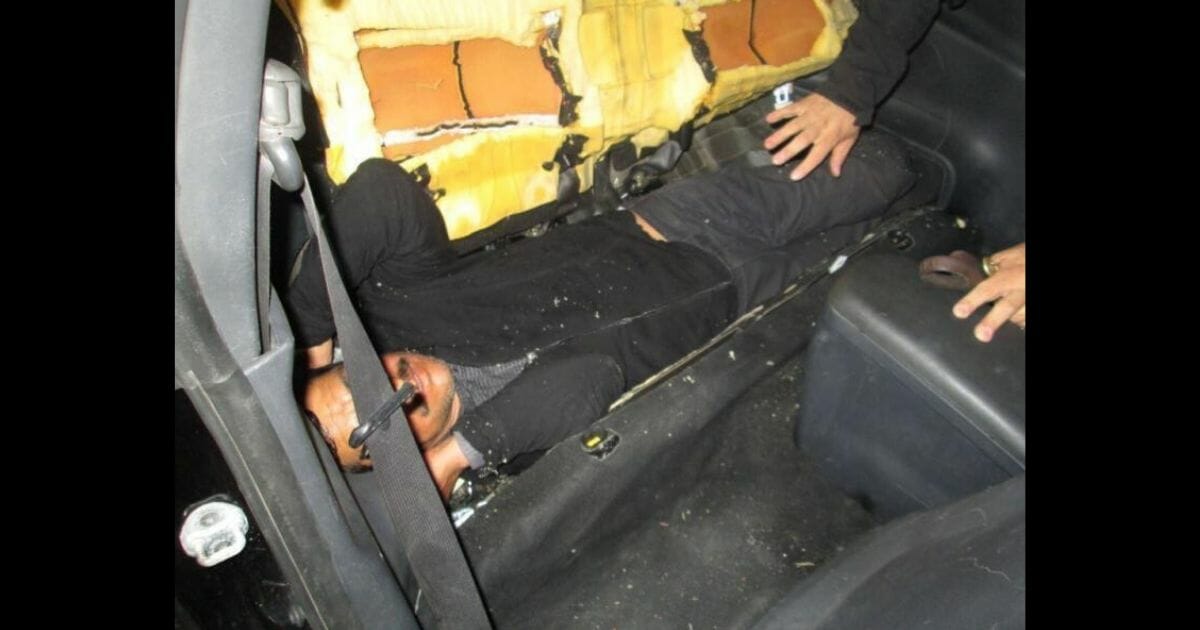 U.S. Customs and Border Protection officers found a Mexican national hidden in the seat of a car at the border.