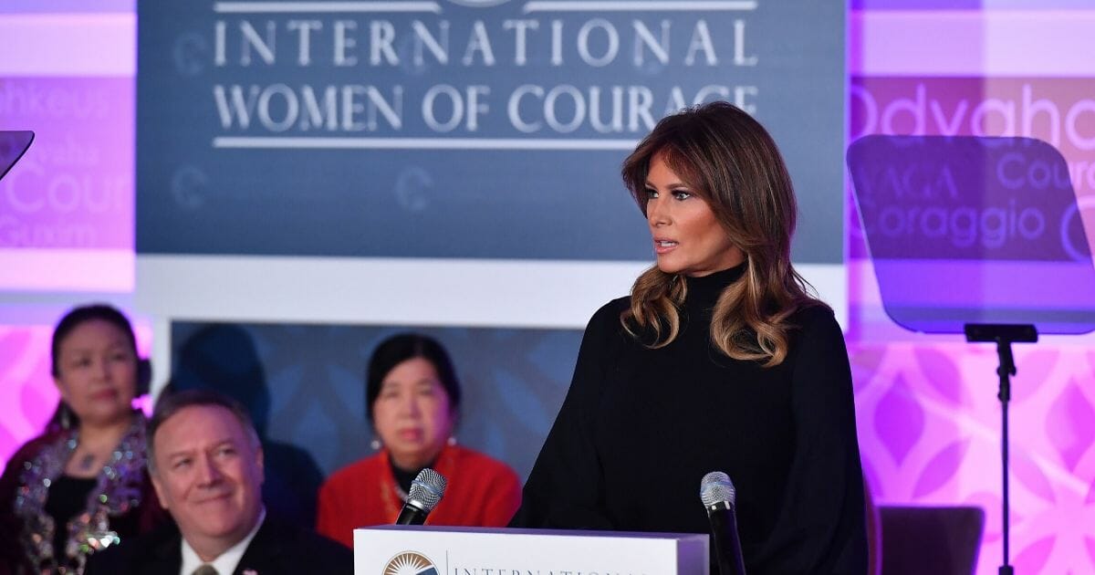 First lady Melania Trump speaks during the annual International Women of Courage Awards at the State Department in Washington, D.C., on March 4, 2020, as Secretary of State Mike Pompeo, left, looks on.