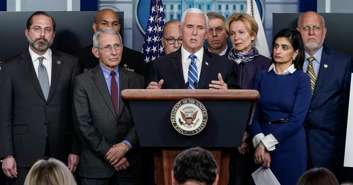 Vice President Mike Pence, standing with members of the White House coronavirus task force team, speaks in the news briefing room of the White House on March 10, 2020, in Washington, D.C.