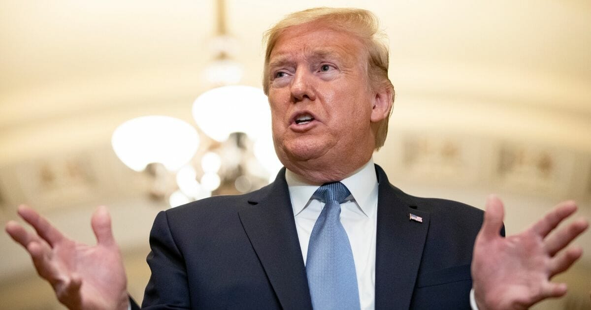 President Donald Trump talks to reporters at the Capitol after attending the Senate Republicans weekly policy luncheon on March 10, 2020.