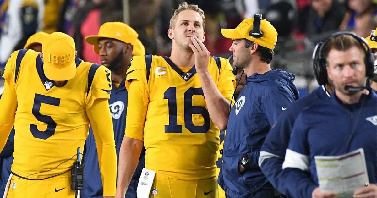 Los Angeles Rams quarterback Jared Goff (No. 16) looks on from the sidelines during a game against the Baltimore Ravens at the Los Angeles Memorial Coliseum on Nov. 25, 2019. The Ravens won 45-6.