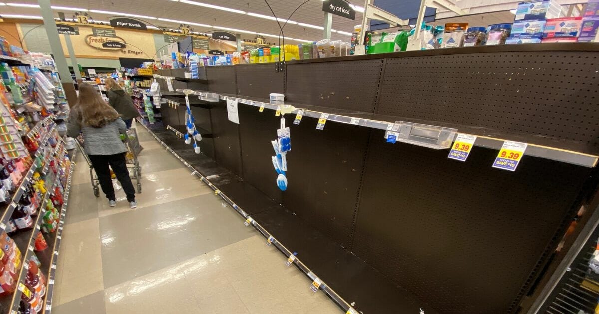 Empty shelves are found at a Kroger grocery store in Grosse Ile, Michigan, on March 13, 2020.