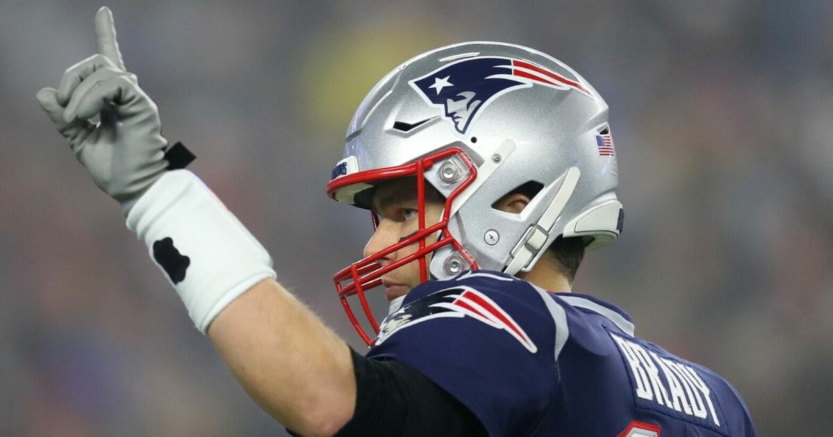 Tom Brady signals to his teammates during the New England Patriots' wild-card playoff game against the Tennessee Titans at Gillette Stadium on Jan. 4, 2020.