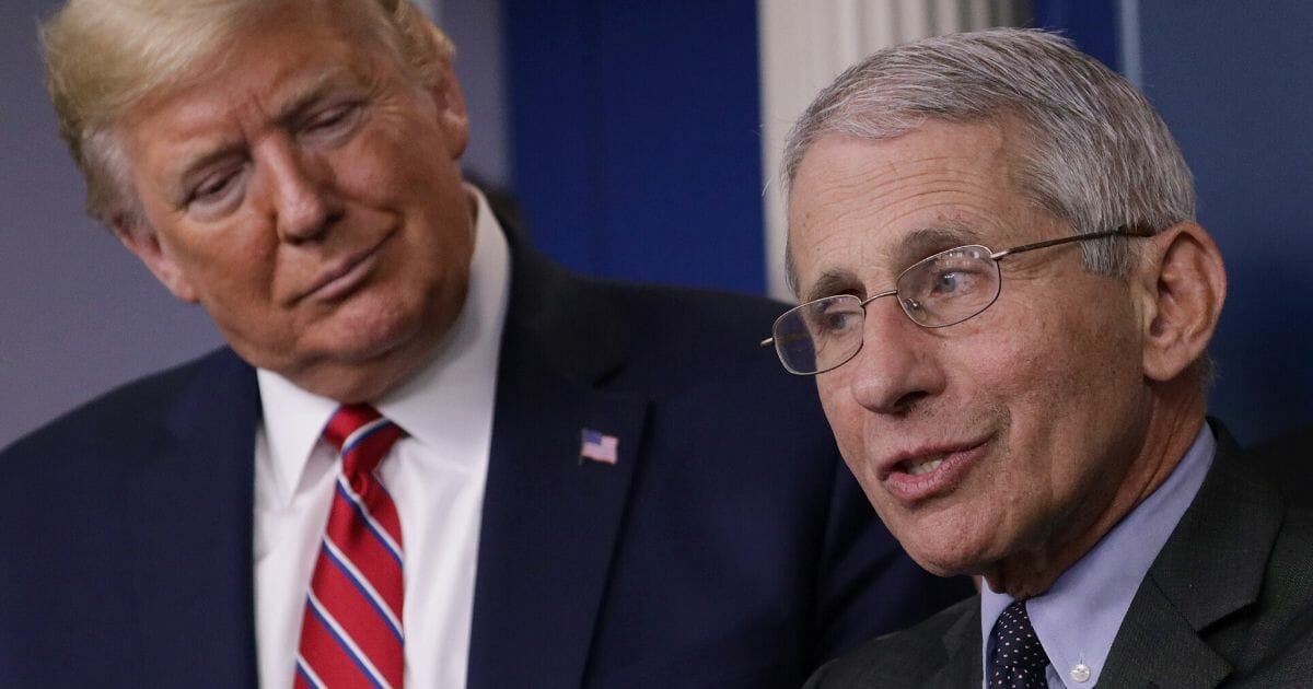 President Donald Trump listens to Dr. Anthony Fauci, director of the National Institute of Allergy and Infectious Diseases, during a corona task force briefing at the White House on March 20, 2020.
