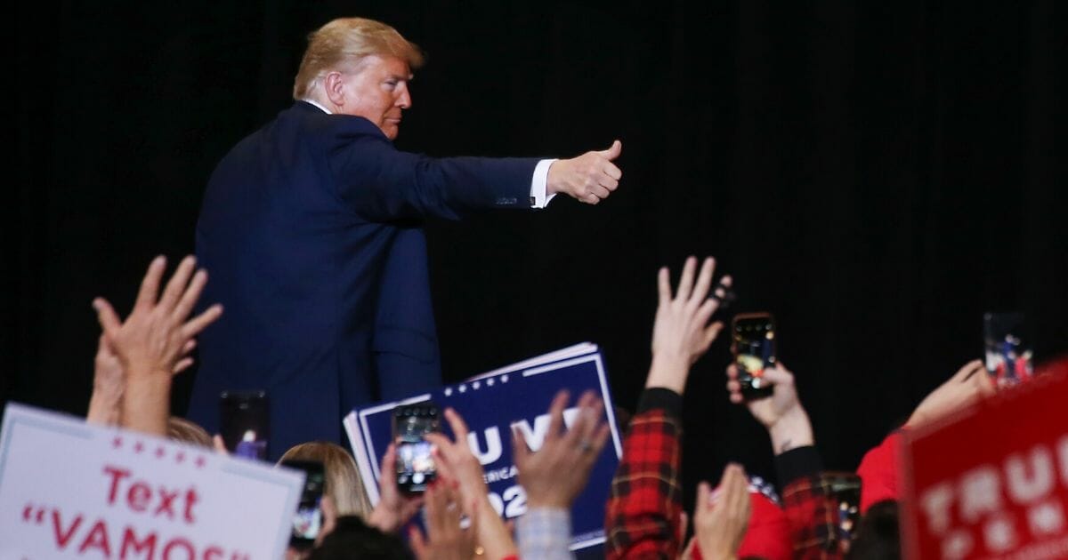 President Donald Trump gives a thumbs up to the crowd as he leaves a campaign rally at the Las Vegas Convention Center on Feb. 21, 2020.
