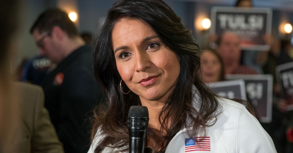 Democratic Rep. Tulsi Gabbard of Hawaii answers media questions following a campaign event in Portsmouth, New Hampshire, on Feb. 9, 2020.
