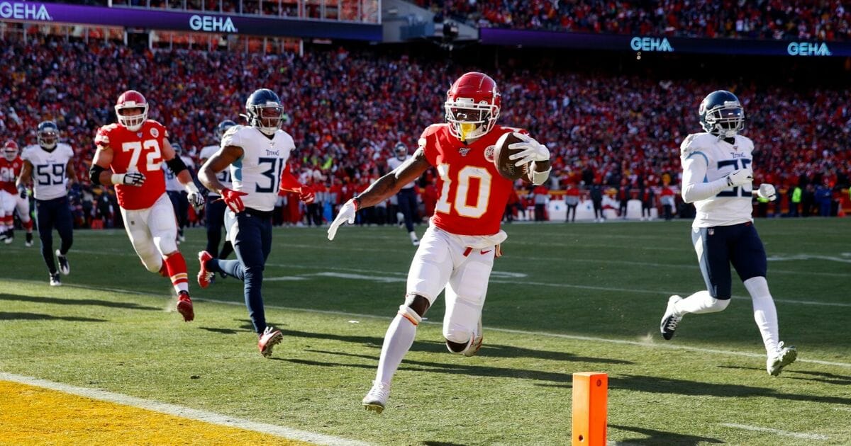 Tyreek Hill #10 of the Kansas City Chiefs runs the ball into the end zone for a touchdown during the AFC championship game against the Tennessee Titans at Arrowhead Stadium on Jan. 19, 2020, in Kansas City, Missouri.