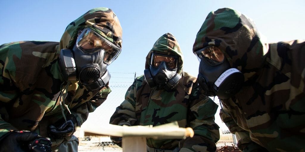 U.S. Airmen with the 163d Attack Wing, California Air National Guard, including Staff Sgt. Kevin Wuerth, left, and Staff Sgt. DMarcus Broussard, right, evaluate a reaction found on chemical detection paper during CBRN Defense training on Jan. 11, 2020, at March Air Reserve Base, California.