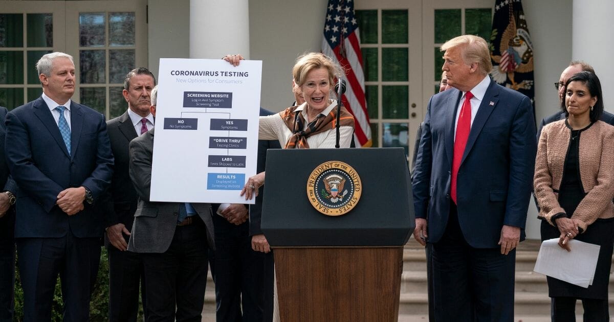 White House coronavirus response coordinator Dr. Deborah Birx holds up a chart about coronavirus testing options as President Donald Trump holds a news conference about the ongoing global coronavirus pandemic at the White House on March 13, 2020 in Washington, D.C.