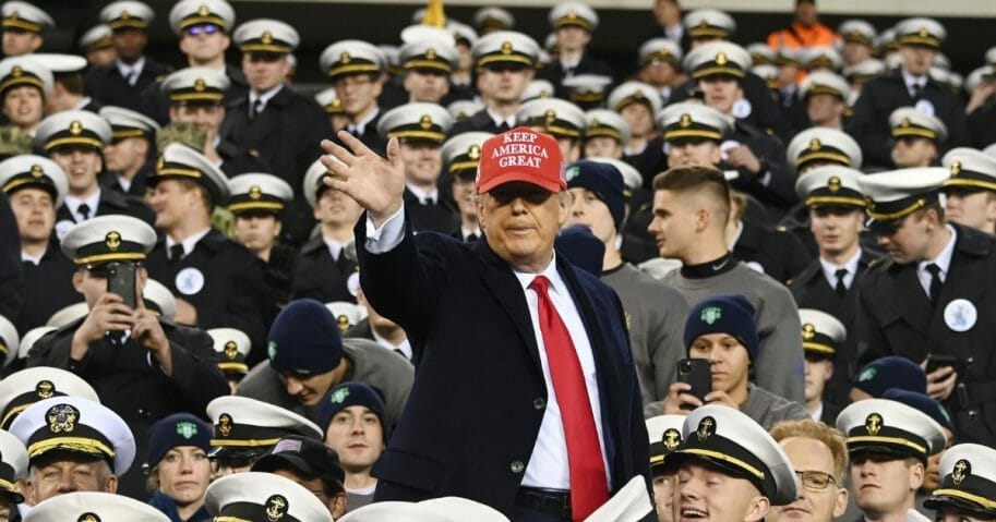 President Donald Trump joins Naval Academy cadets during the the Army vs. Navy American football game in Philadelphia on Dec. 14, 2019.