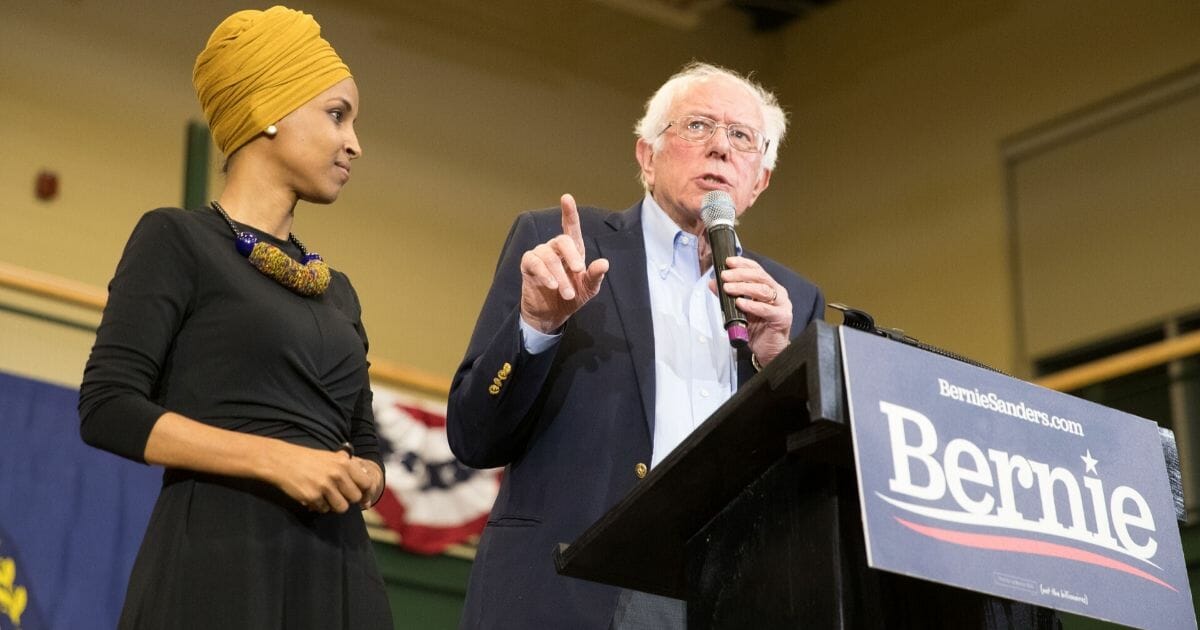 U.S. Rep. Ilhan Omar of Minnesota joins Vermont Sen. Bernie Sanders during a campaign rally in New Hampshire in December.