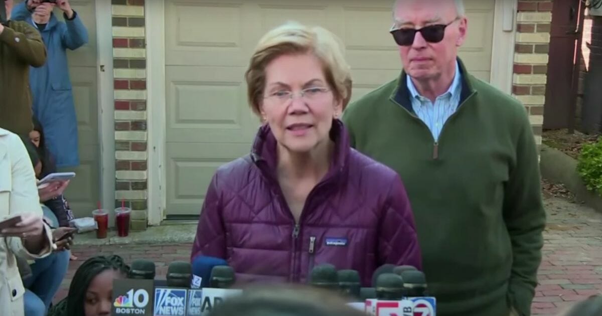 Massachusetts Sen. Elizabeth Warren speaks to the media outside her home in Cambridge, Massachusetts, after announcing she was dropping out of the Democratic presidential primary race on March 5, 2020.