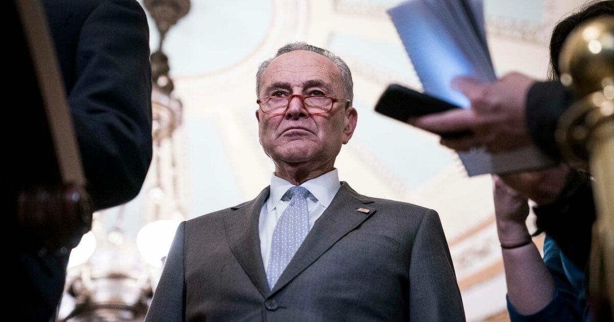 Senate Minority Leader Sen. Chuck Schumer listens during a news conference following the weekly Democratic caucus luncheon where U.S. Vice President Mike Pence, Secretary of Health and Human Services Alex Azar and members of the coronavirus task force briefed senators on March 3, 2020, in Washington, D.C.