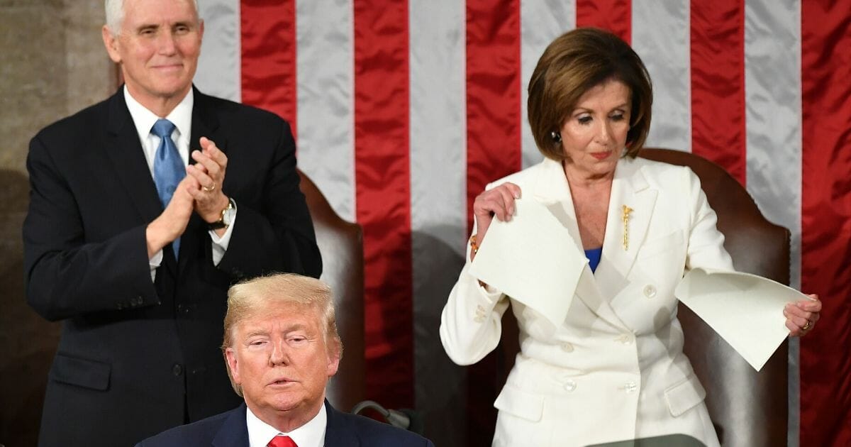House Speaker Nancy Pelosi tears a copy of President Donald Trump's Stater of the Union address at the Capitol on Feb. 4.