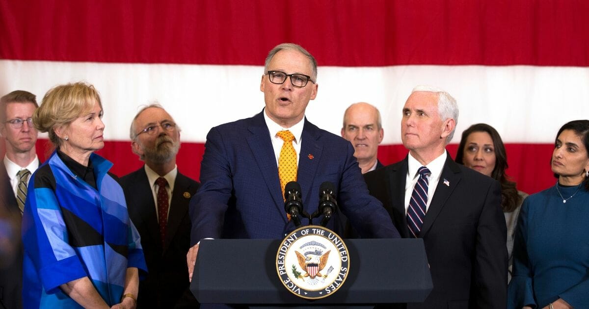 Washington State Gov. Jay Inslee addresses the media during a visit by Vice President Mike Pence to discuss concerns over the coronavirus, COVID-19, on March 5, 2020, at Camp Murray, adjacent to Joint Base Lewis-McChord, Washington.
