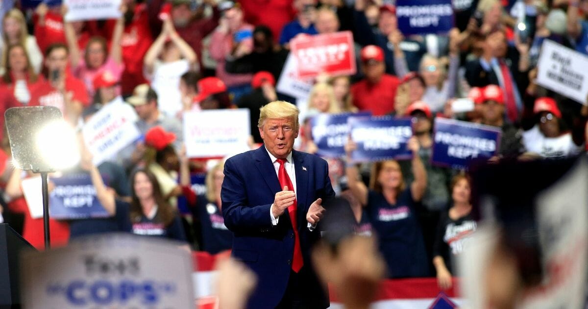 President Donald Trump applauds the crowd during a March 2 rally in Charlotte, North Carolina.