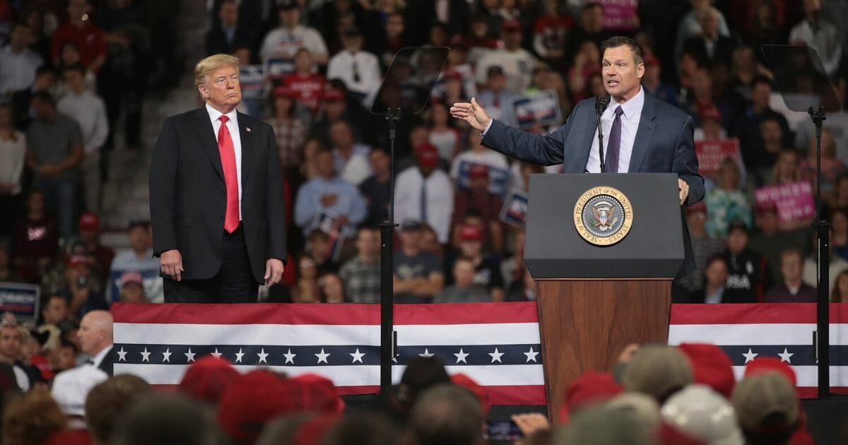 Then-candidate for governor of Kansas Kris Kobach speaks at a rally with President Donald Trump at the Kansas Expocenter on Oct. 6, 2018, in Topeka, Kansas.