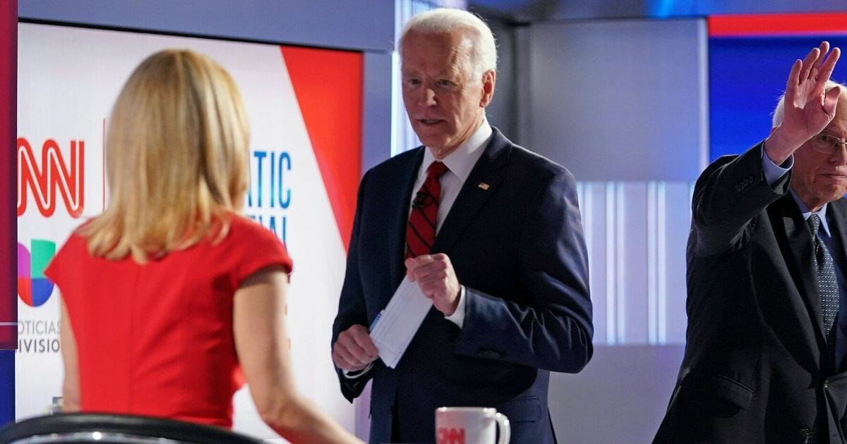 Former Vice President Joe Biden chats with CNN's Dana Bash on Sunday after the two-hour Democratic primary debate in Washington.