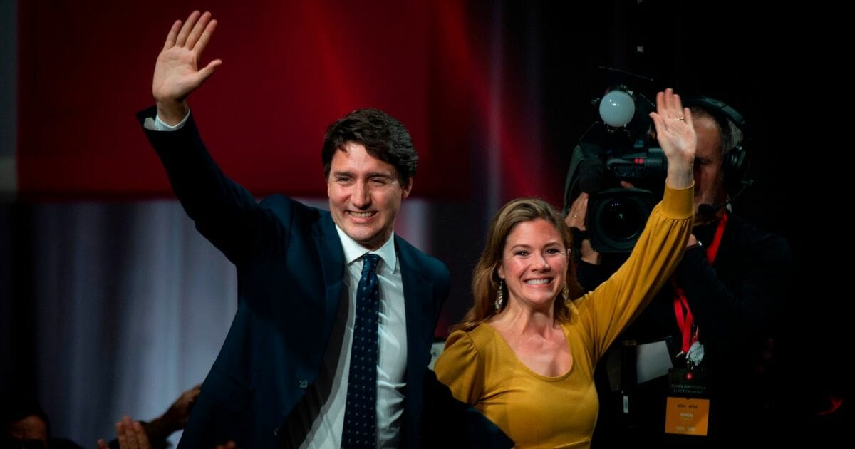 Canadian Prime Minister Justin Trudeau and his wife Sophie Grégoire Trudeau arrive to celebrate his victory with his supporters at the Palais des Congres in Montreal, Canada, on Oct. 21, 2019.