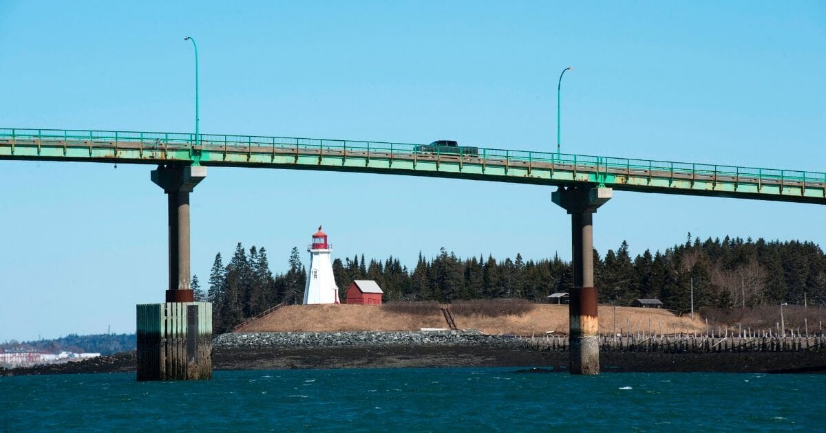 A car crosses the International Bridge between Lubec, Maine, left, and Campobello Island, Canada, on March 3, 2017, on the U.S.-Canada border.