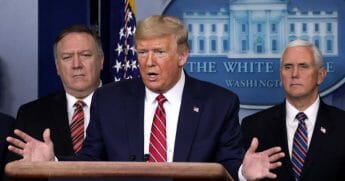 President Donald Trump speaks as Secretary of State Mike Pompeo, left, and Vice President Mike Pence listen during a news briefing on the latest development of the coronavirus outbreak in the U.S. at the James Brady Press Briefing Room at the White House on March 20, 2020, in Washington, D.C.