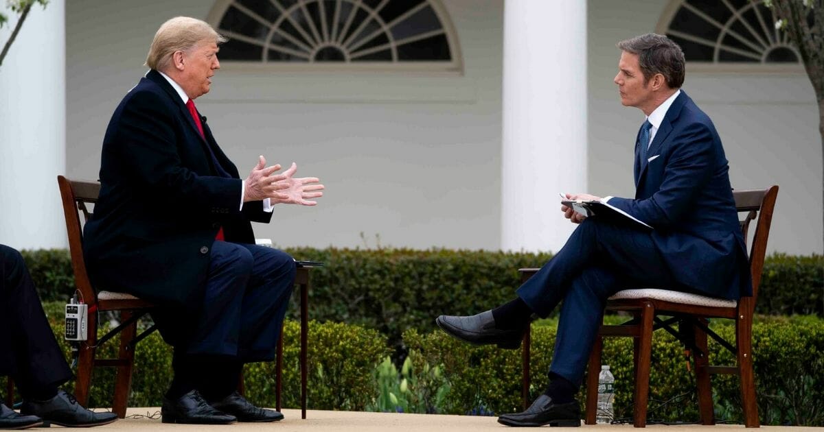 President Donald Trump participates in a Fox News virtual town hall with anchor Bill Hemmer in the Rose Garden of the White House on March 24, 2020, in Washington, D.C.