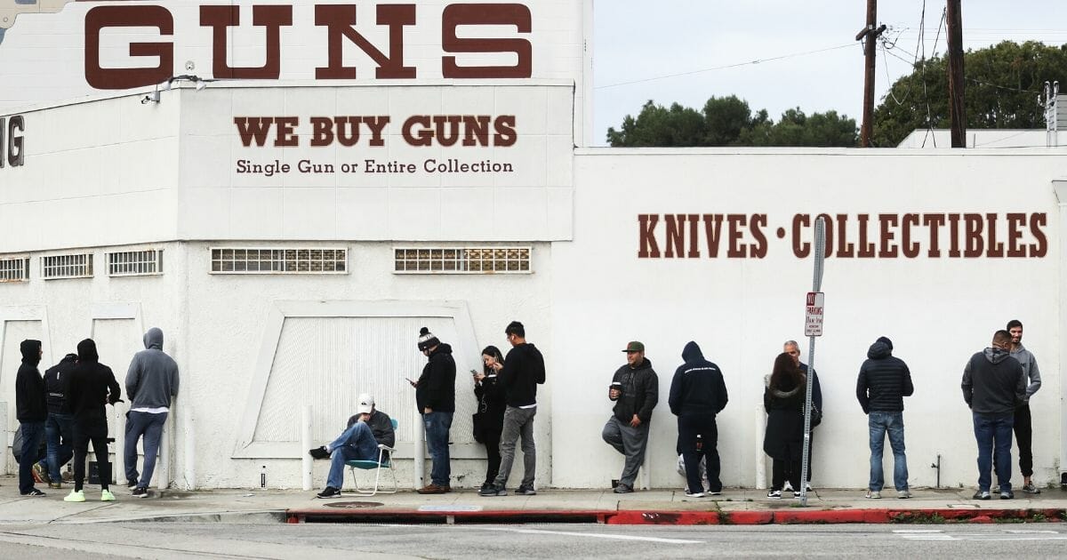 People stand in line outside the Martin B. Retting, Inc. gun store on March 15, 2020, in Culver City, California.