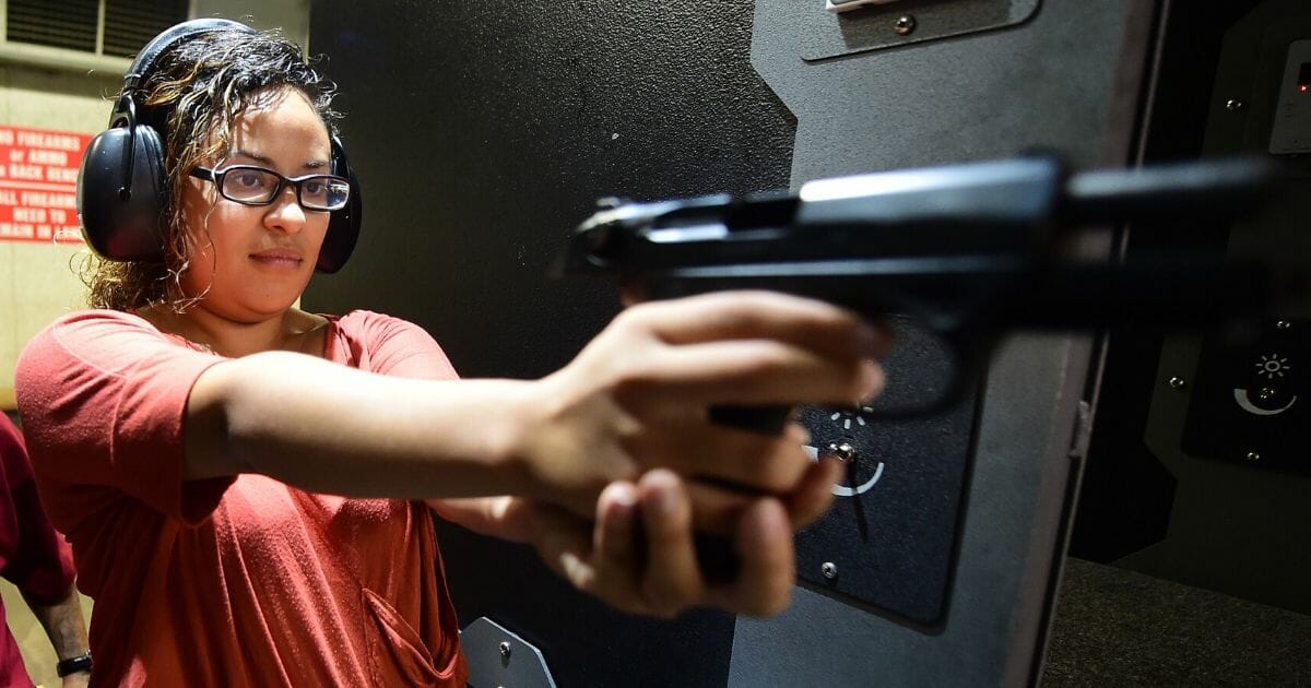 Brenda Reyes practices her stance at the LAX Firing Range in Inglewood, California, on Sept. 7, 2016.