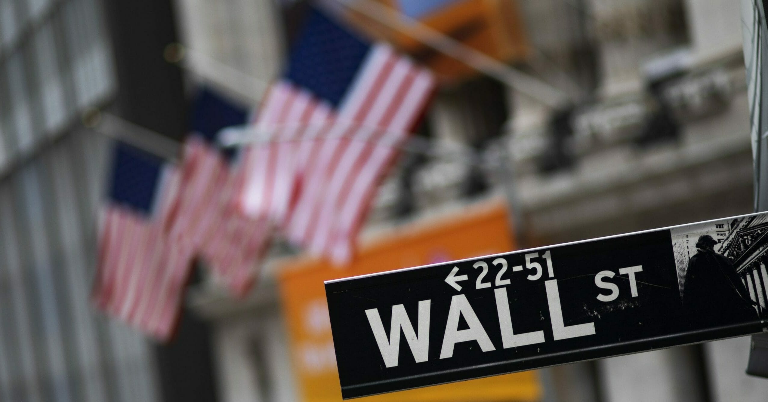 A Wall Street sign is seen in front of the New York Stock Exchange on Jan. 31, 2020.