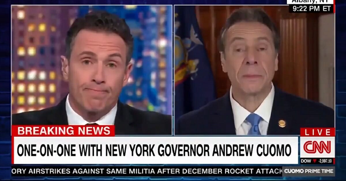 CNN host Chris Cuomo, left, interviews his brother, New York Gov. Andrew Cuomo, right.