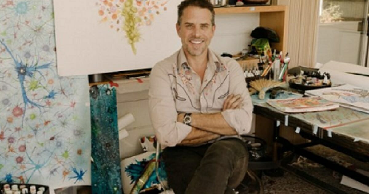 Hunter Biden pictured with his painting supplies and paintings.