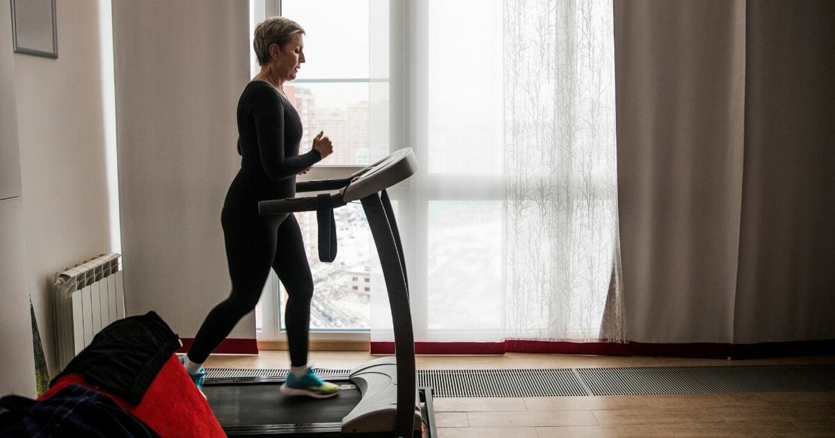 A woman exercises on a treadmill in the stock image above.