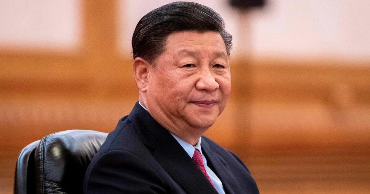 Chinese President Xi Jinping attends a meeting at the Great Hall of the People in Beijing on June 25, 2019.