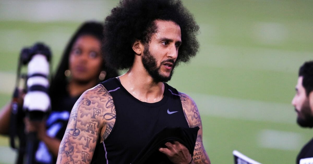 Colin Kaepernick looks on during his NFL workout at Charles R. Drew High School in Riverdale, Georgia, on Nov. 16, 2019.