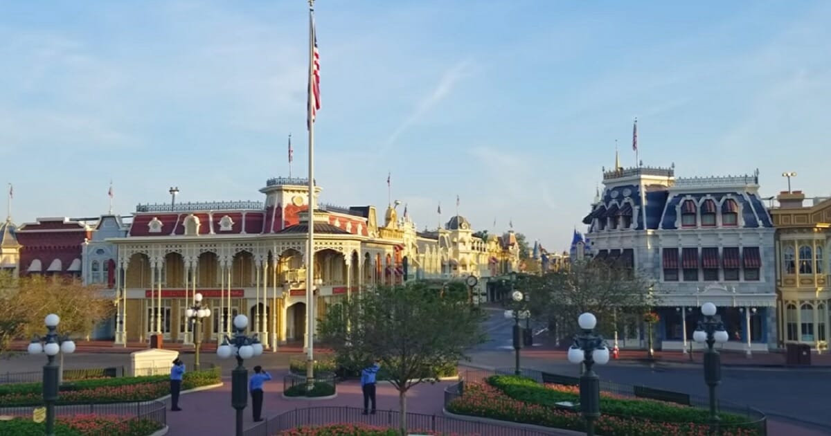 An American flag is raised over Disney World.