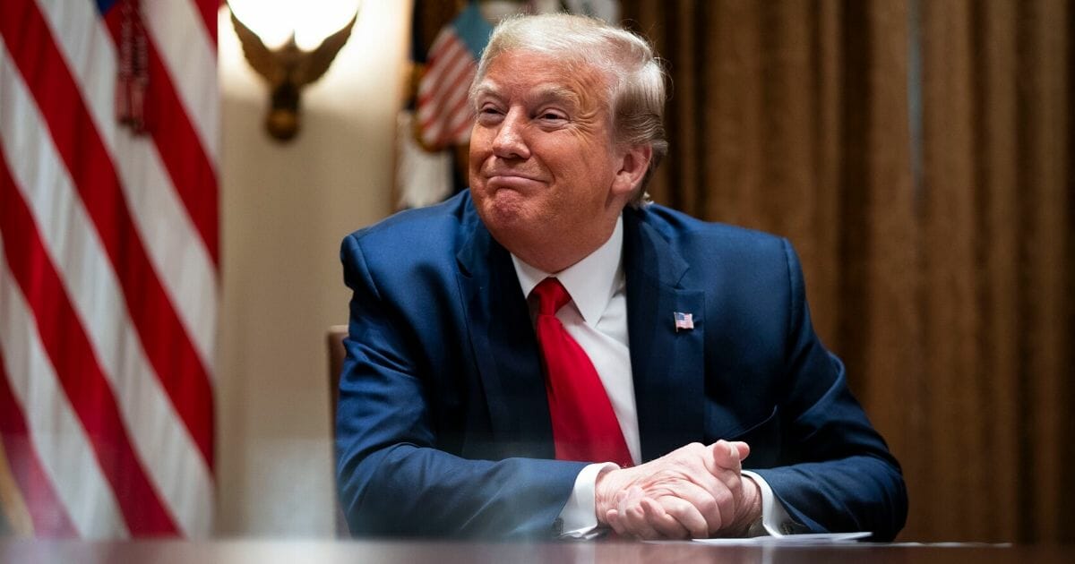 President Donald Trump listens during a meeting with health care executives in the Cabinet Room of the White House on April 14, 2020.