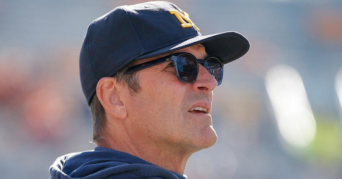 Michigan head coach Jim Harbaugh looks on during the Wolverines' 42-25 victory over Illinois at Memorial Stadium in Champaign, Illinois, on Oct. 12, 2019.