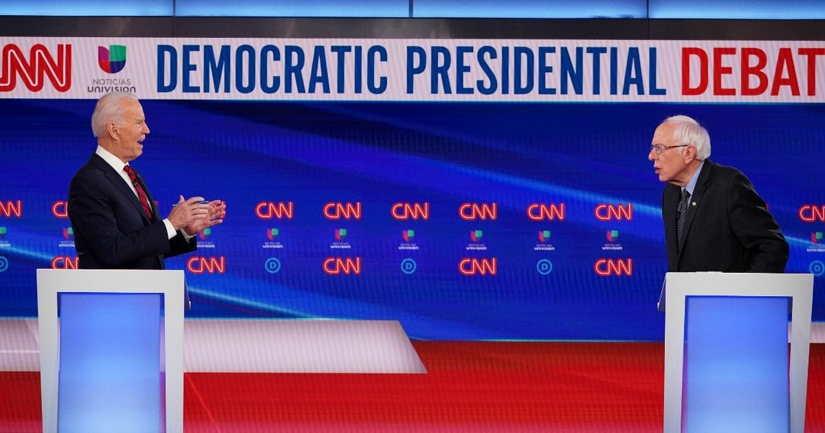 Former Vice President Joe Biden and Vermont Sen. Bernie Sanders take part in the 11th Democratic Party 2020 presidential debate in a CNN Washington Bureau studio in Washington, D.C., on March 15, 2020.