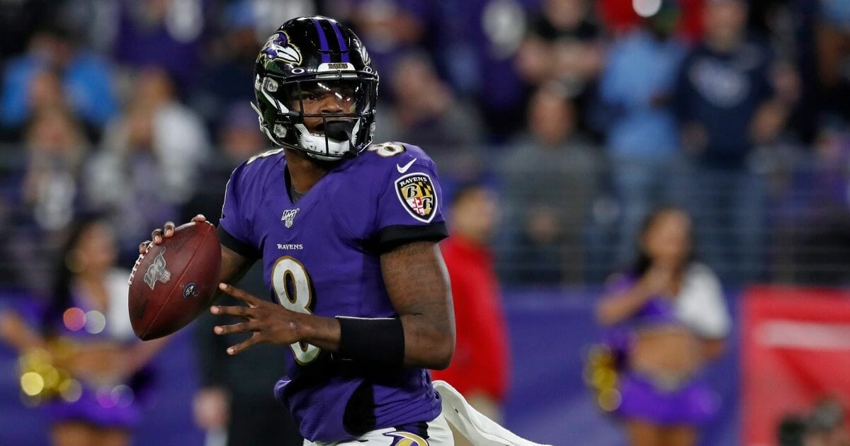 Lamar Jackson #8 of the Baltimore Ravens throws the ball during the fourth quarter of the AFC divisional playoff game against the Tennessee Titans at M&T Bank Stadium on Jan. 11, 2020, in Baltimore, Maryland.