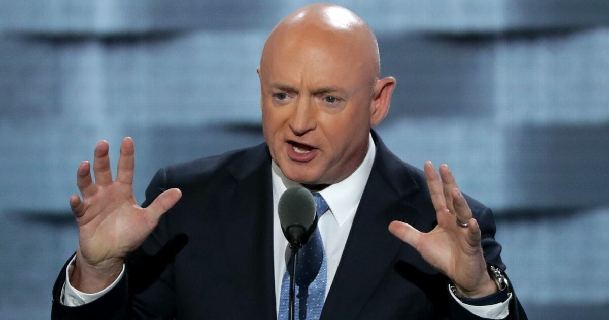Retired NASA astronaut Mark Kelly praises presidential candidate Hillary Clinton during remarks on the third day of the Democratic National Convention at the Wells Fargo Center in Philadelphia on July 27, 2016.