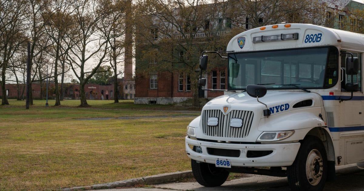 A New York Corrections Department bus is parked on the grounds of Hart Island, a former prison and Nike missile silo site which is now the largest public burial ground in the United States, on Oct. 25, 2019, in New York City.
